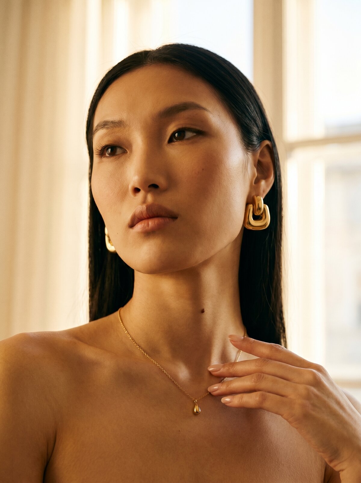 Everyday Luxury, portrait with a gold necklace