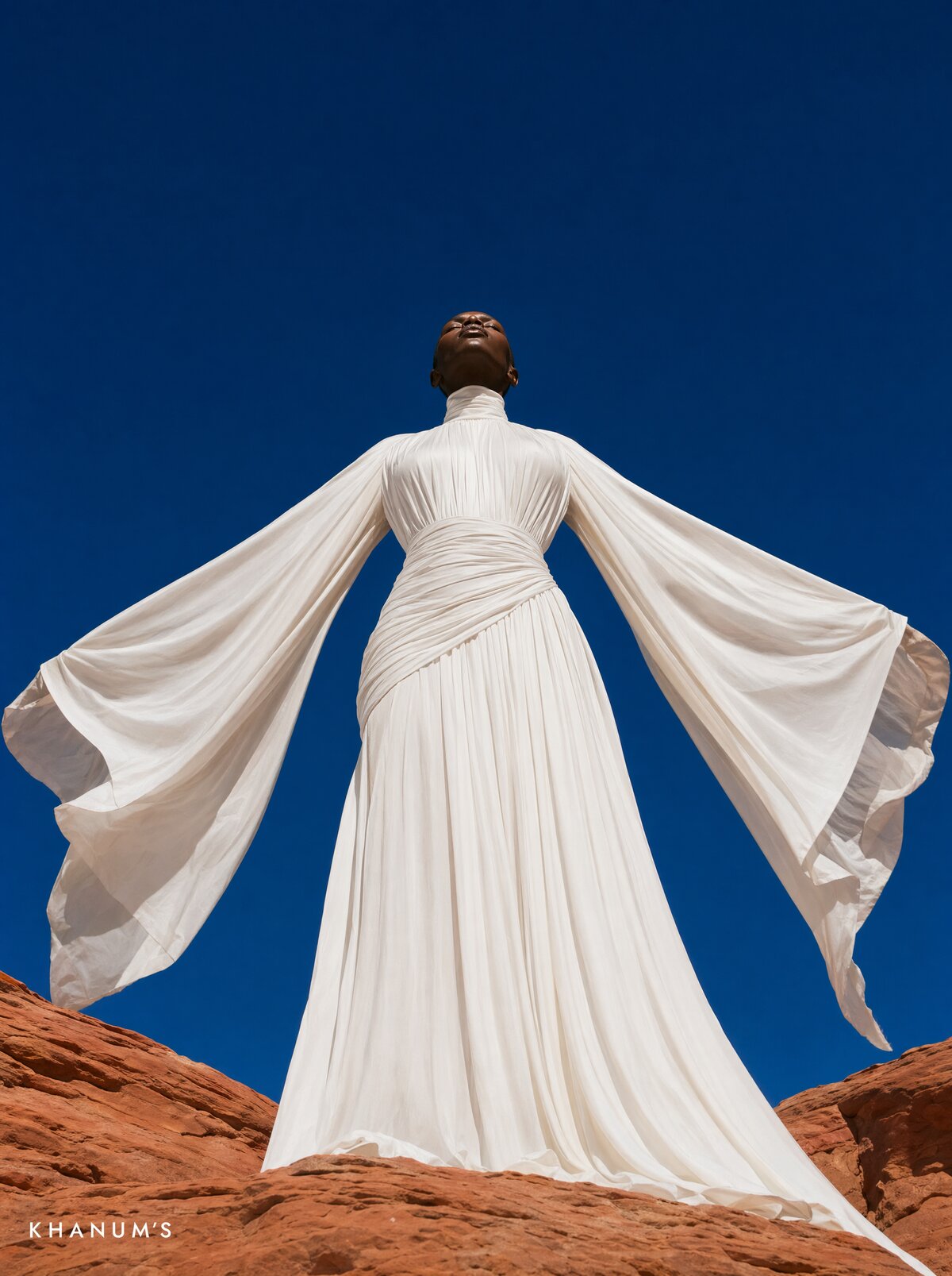 Khanum's, white gown, dramatic back view, dune at sunrise